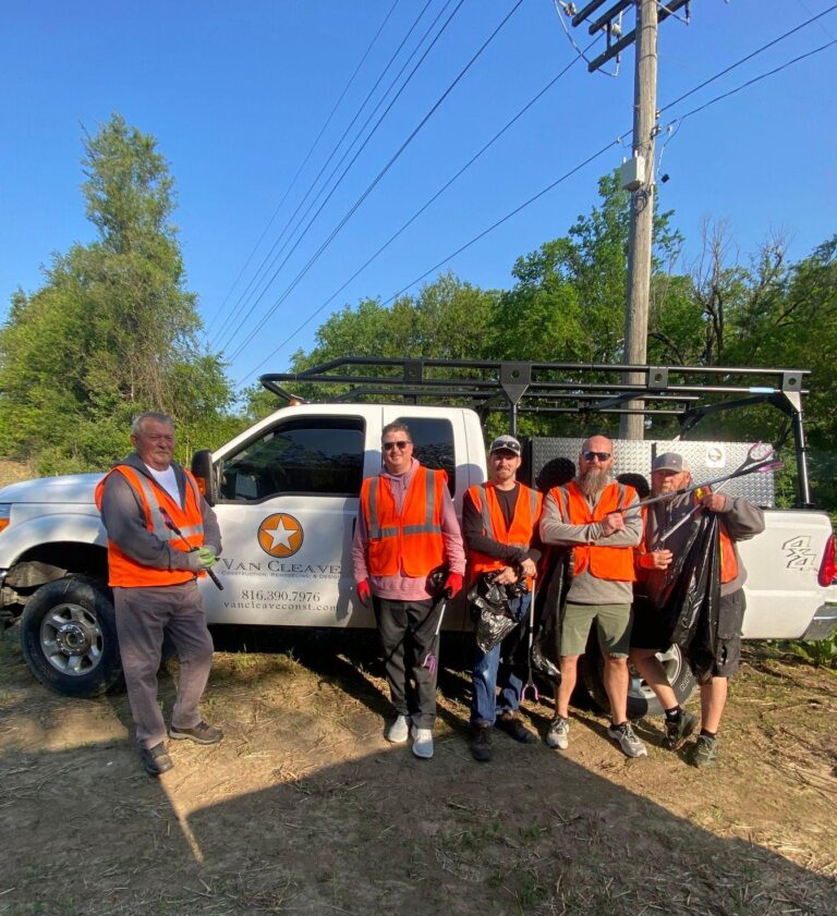 Employees at Van Cleave Construction, Remodeling, and Design spending their time cleaning up Cook Road in St. Joseph, MO as part of Adopt-A-Block.