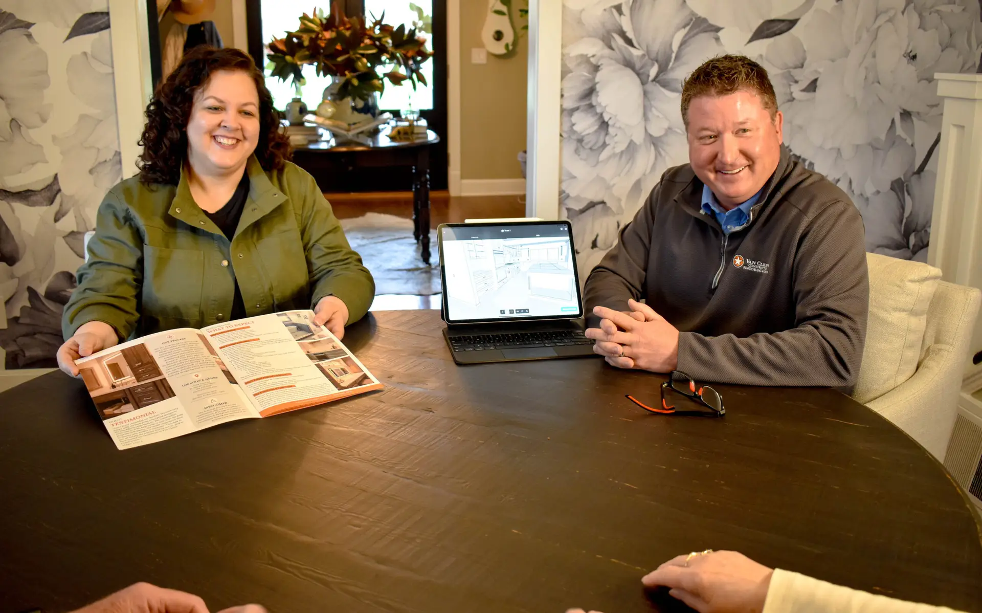 Sales Person and Designer meeting with Home Owners for an in-home consultation to review the Van Cleave Construction, Remodeling, and Design design build process.